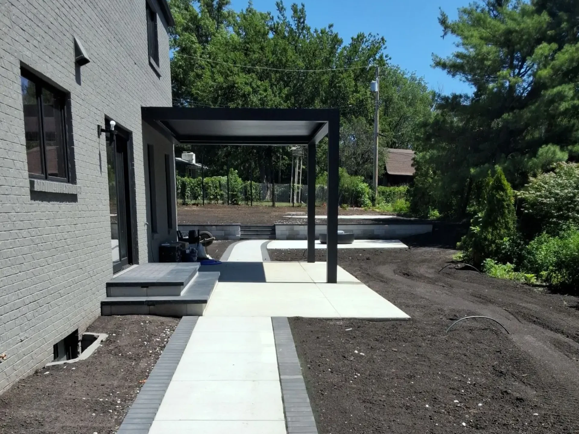 Attached metal pergola