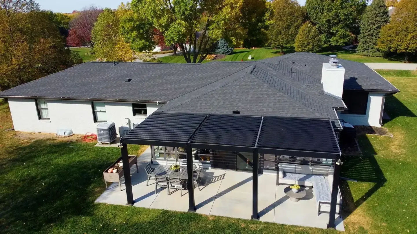 Attached patio covered with louvered pergola