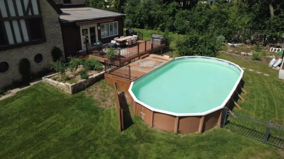 aerial-view-of-the-big-pool-connected-to-deck-installation-with-black-metal-railing-in-lincoln-ne