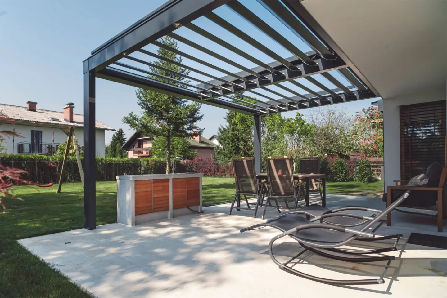 backyard-of-a-modern-house-with-pergola-and-clean-lawn-with-trees-on-the-background-in-lincoln-ne