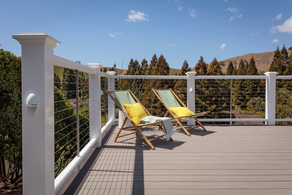 coastline-decking-with-outdoor-chairs-and-wire-railing-with-overlooking-trees-and-mountain-view-in-lincoln-ne