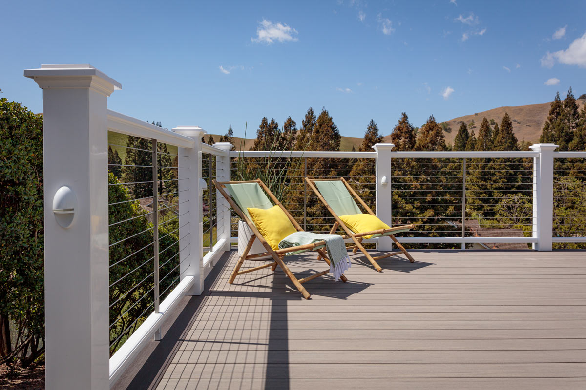 coastline-decking-with-outdoor-chairs-and-wire-railing-with-overlooking-trees-and-mountain-view-in-lincoln-ne