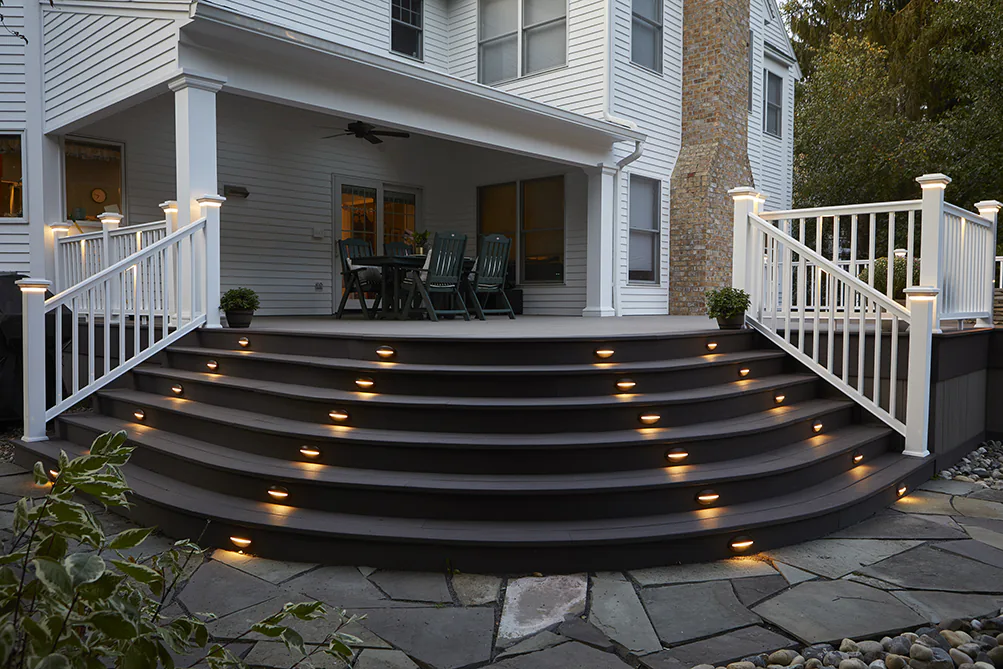 composite-deck-with-lighting-in-stairs-steps-and-white-railing-in-lincoln-ne