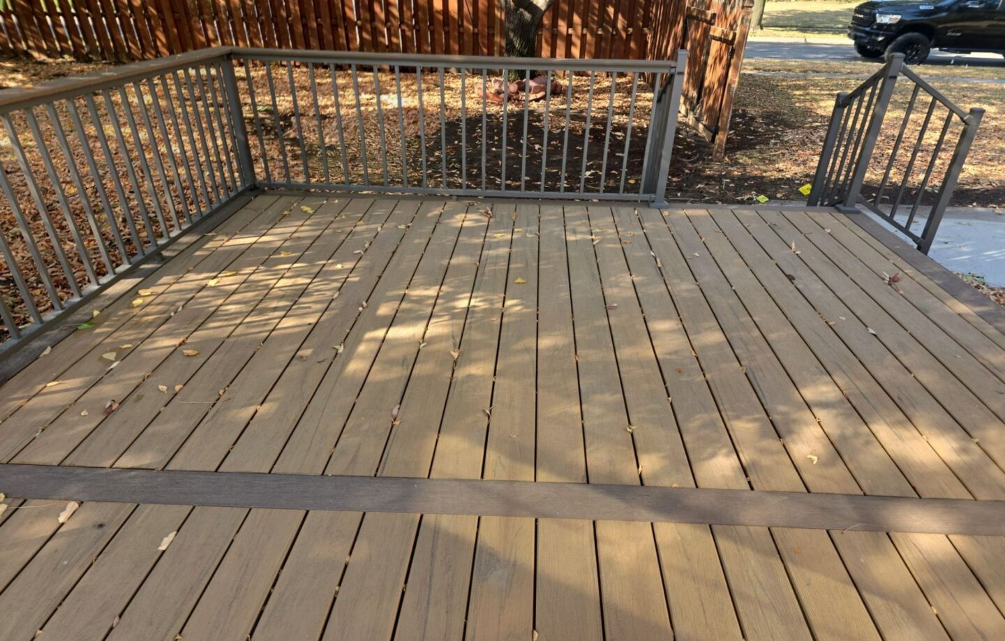 composite-decking-with-railing-and-wooden-wall-fence-in-lincoln-ne