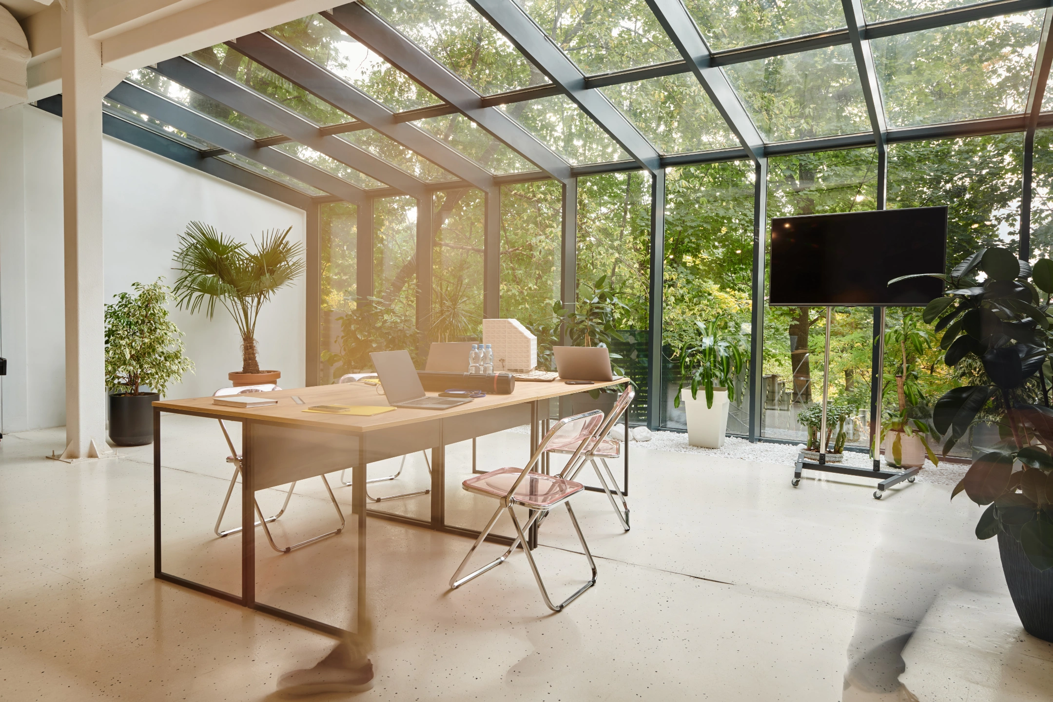 elegant-3-sunroom-with-office-furniture-and-trees-and-plants-on-the-background-in-lincoln-ne