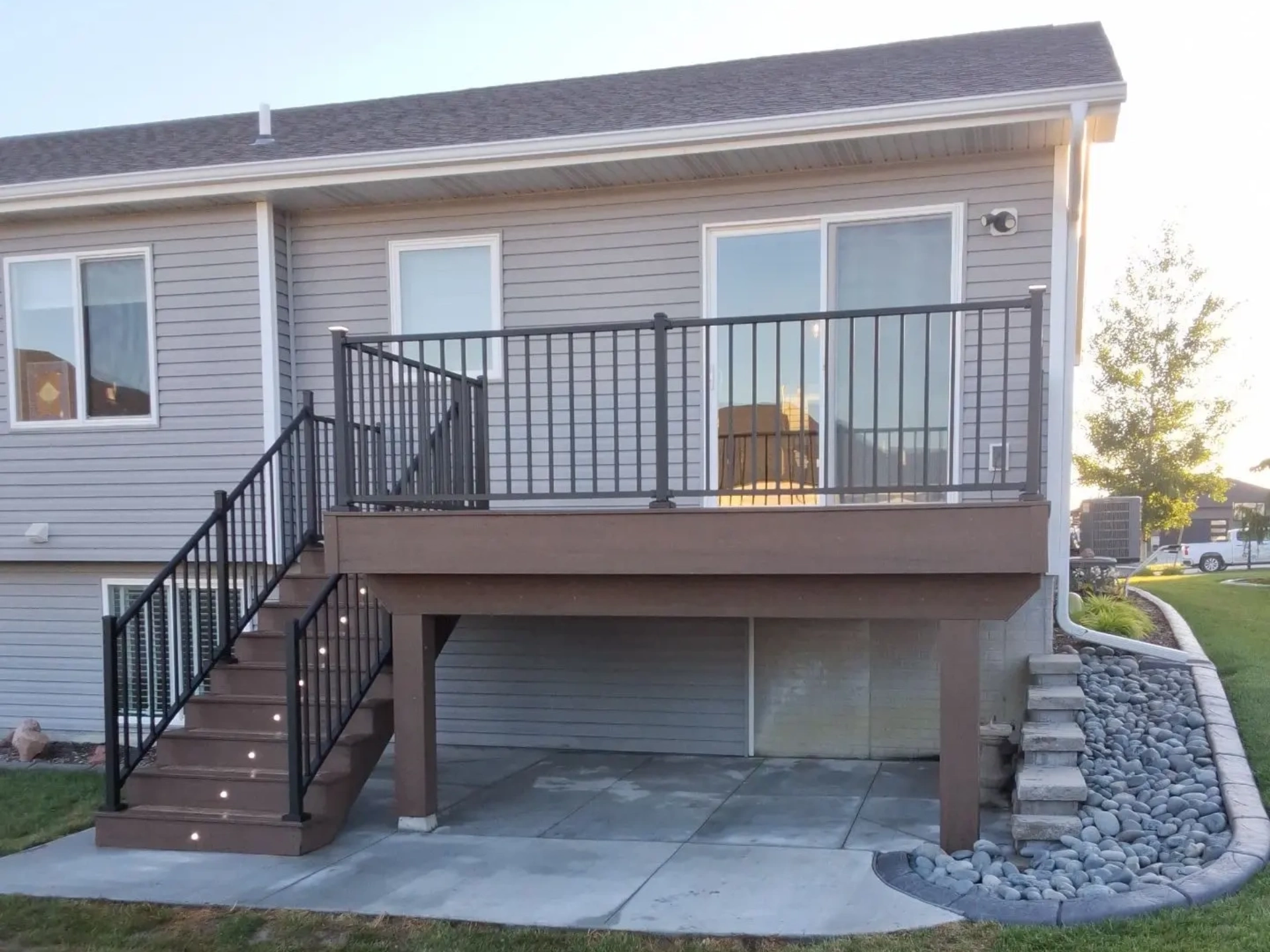 elevated-deck-with-black-metal-railing-and-a-lighting-on-stairs-steps-in-lincoln-ne