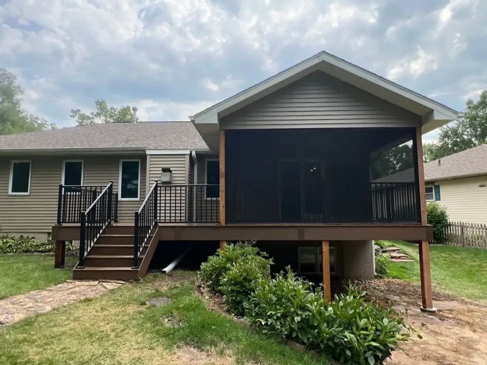 elevated-deck-with-black-metal-railing-and-screened-in-porch-in-lincoln-ne