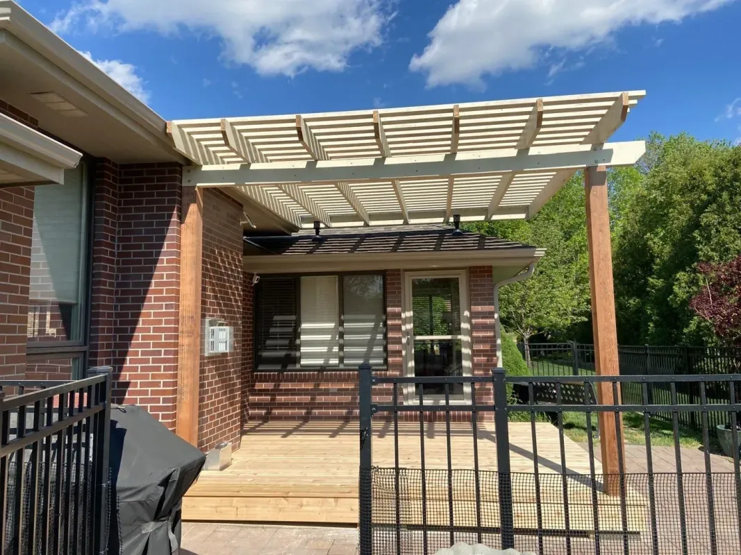 front-view-of-the-black-metal-fence-and-a-pergola-on-the-custom-deck-in-lincoln-ne