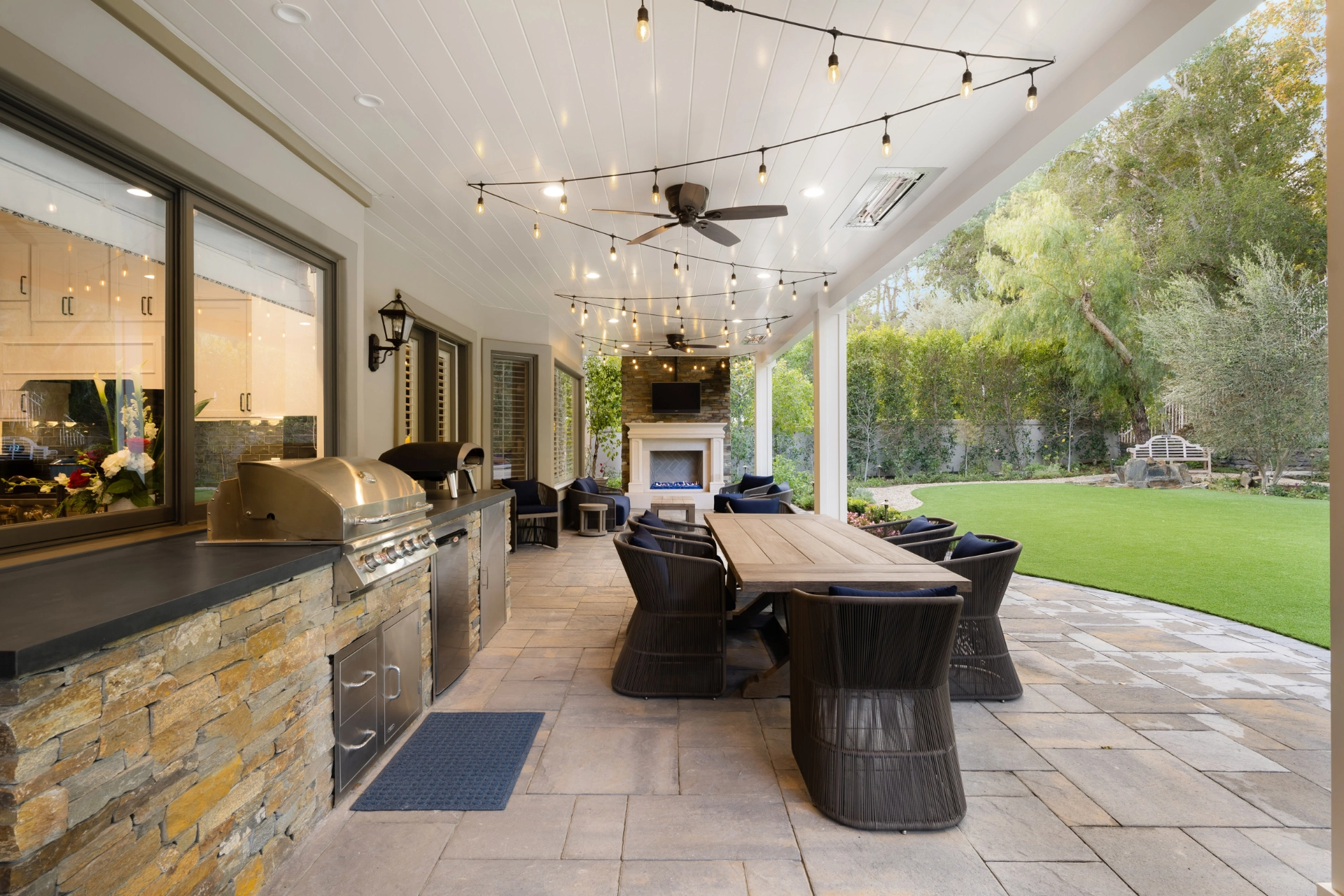 interior-shot-of-an-patio-with-outdoor-kitchen-and-fireplace-with-overlooking-view