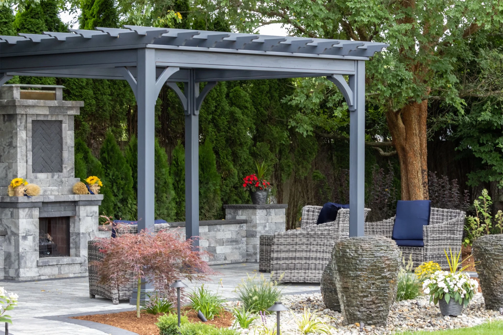 landscape-architecture-patio-featuring-pergola-and-stone-fireplace-in-lincoln-ne