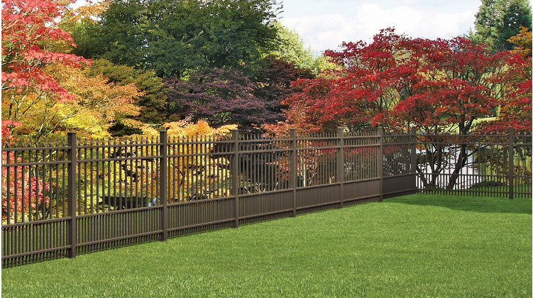 long-aluminium-fence-with-beautiful-colors-of-trees-on-the-background-in-lincoln-ne