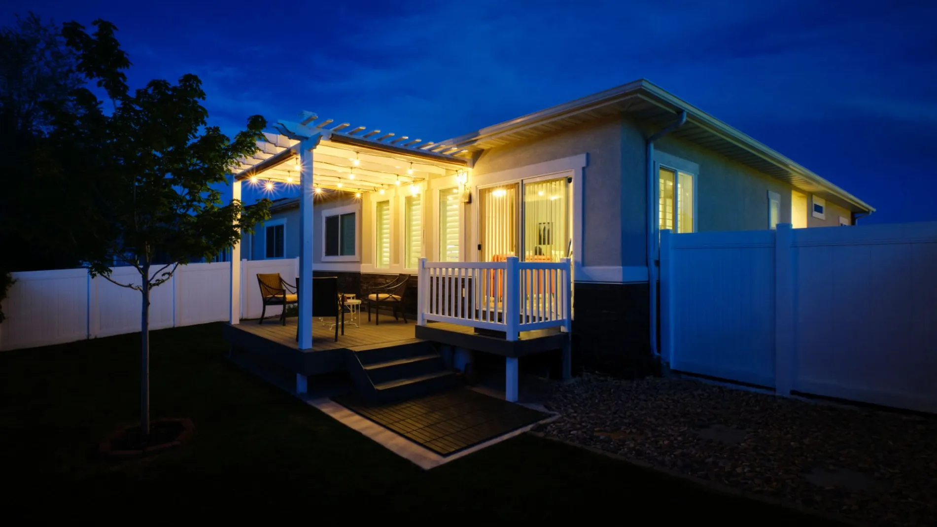 night-scene-modern-patio-lighting-in-residential-deck-with-white-railing-in-lincoln-ne