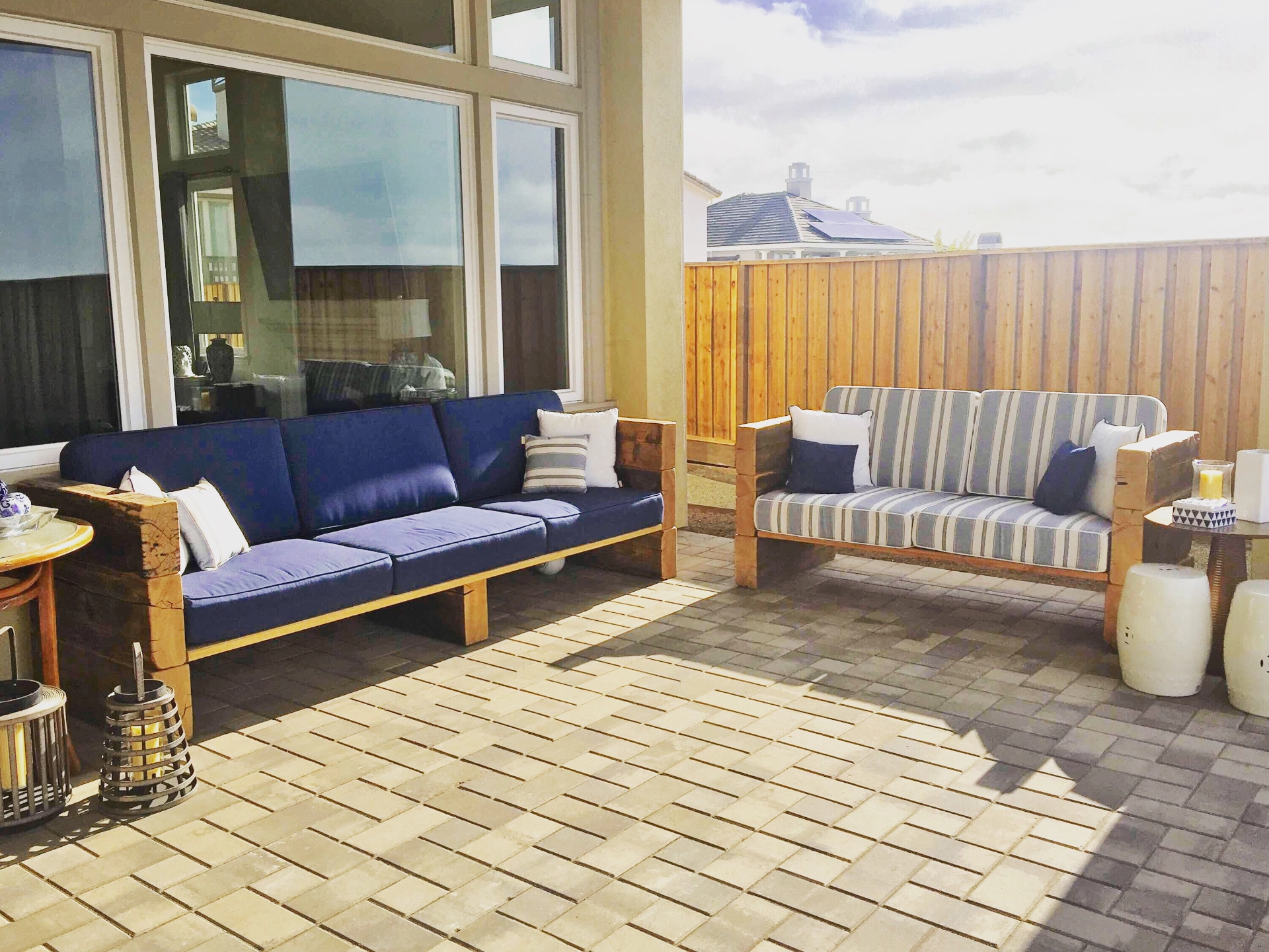 patio-with-outdoor-sofa-home-decor-and-big-wooden-fence-in-lincoln-ne