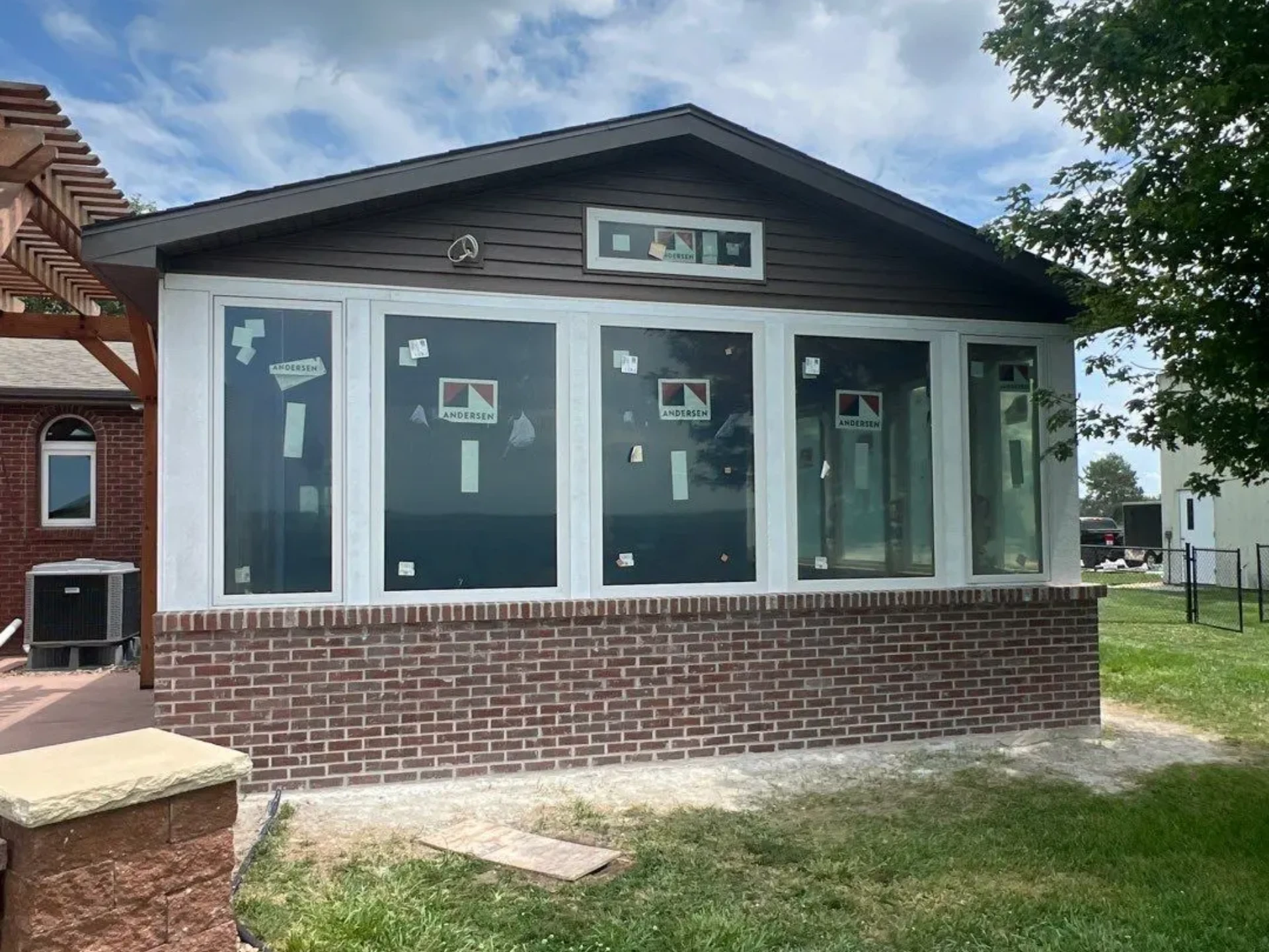 porch-enclosure-with-wooden-pergola-in-lincoln-ne