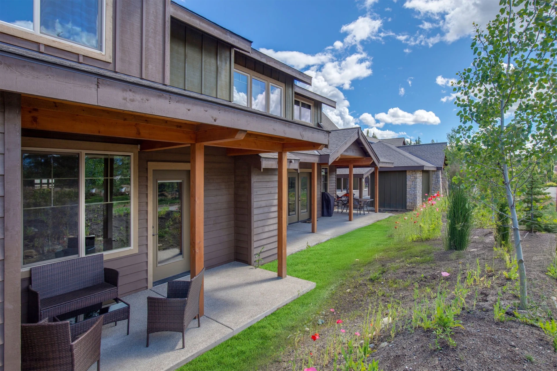 porch-exterior-natural-brown-and-gray-colored-house-with-overlooking-nature-view-in-lincoln-ne
