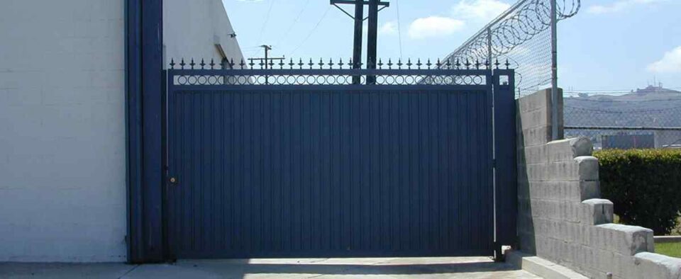 sliding-metal-gate-with-wire-mesh-railing-installation-in-lincoln-ne
