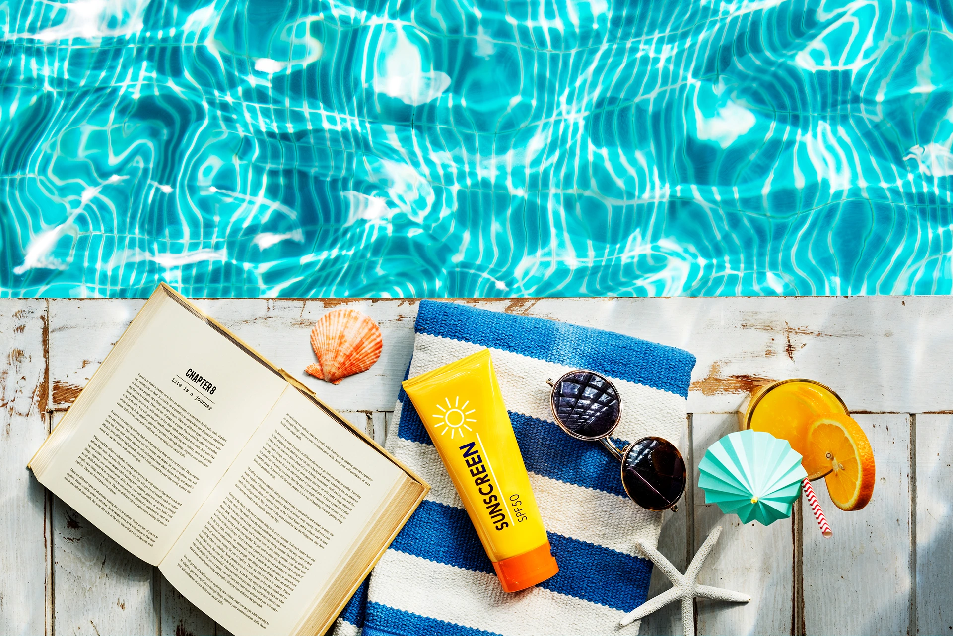 sunscreen-sunglasses-towel-book-recess-relax-beside-the-clean-swimming-pool-in-lincoln-ne