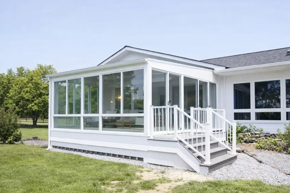 white-home-with-a-porch-enclosure-and-white-railing-in-lincoln-ne